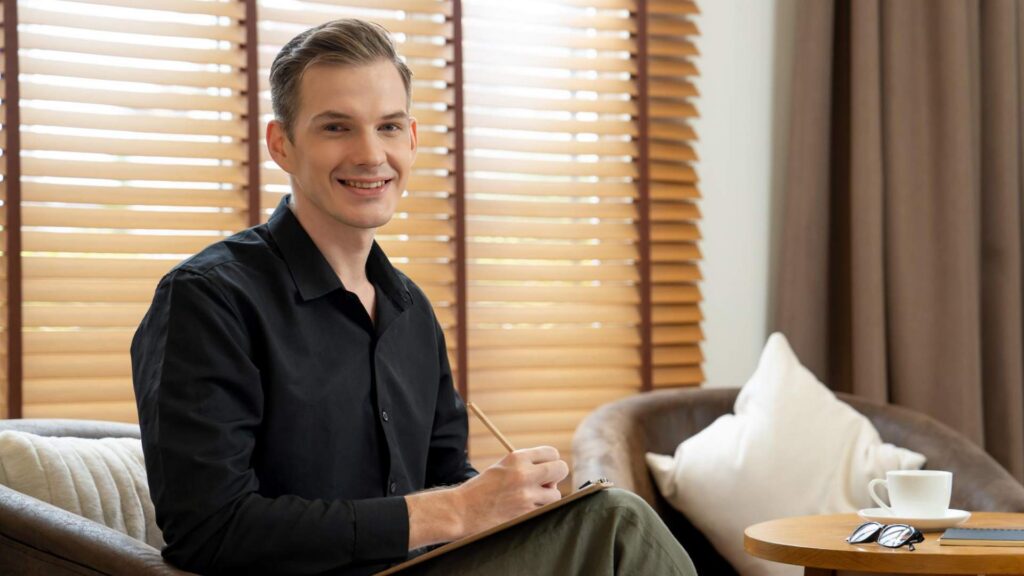 Man writing notes during Hormone Replacement Therapy for Men in Centennial consultation