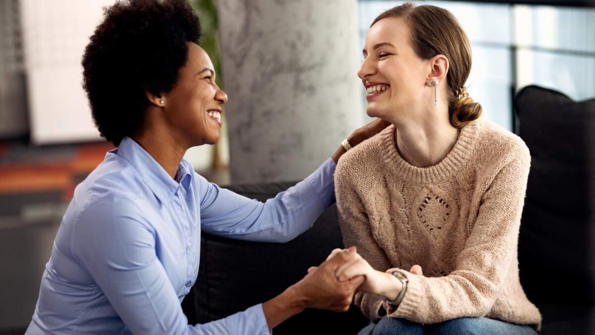 Two women in a supportive setting discussing Ketamine for Anxiety in Centennial