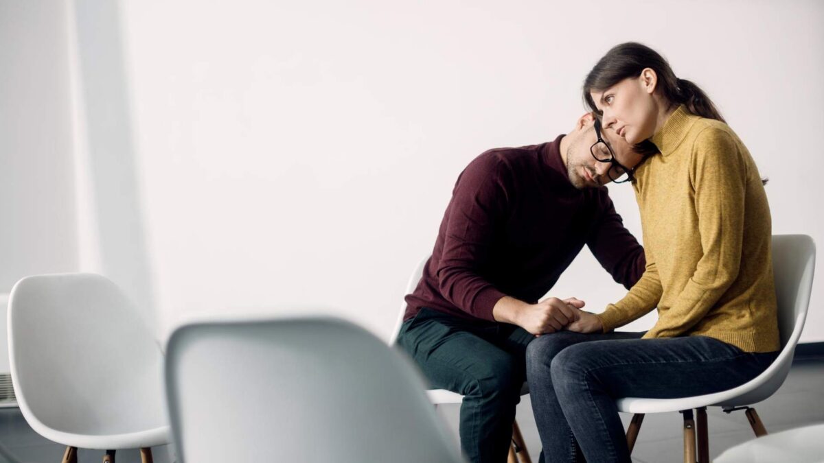 Supportive couple embracing during Ketamine for PTSD in Centennial treatment journey