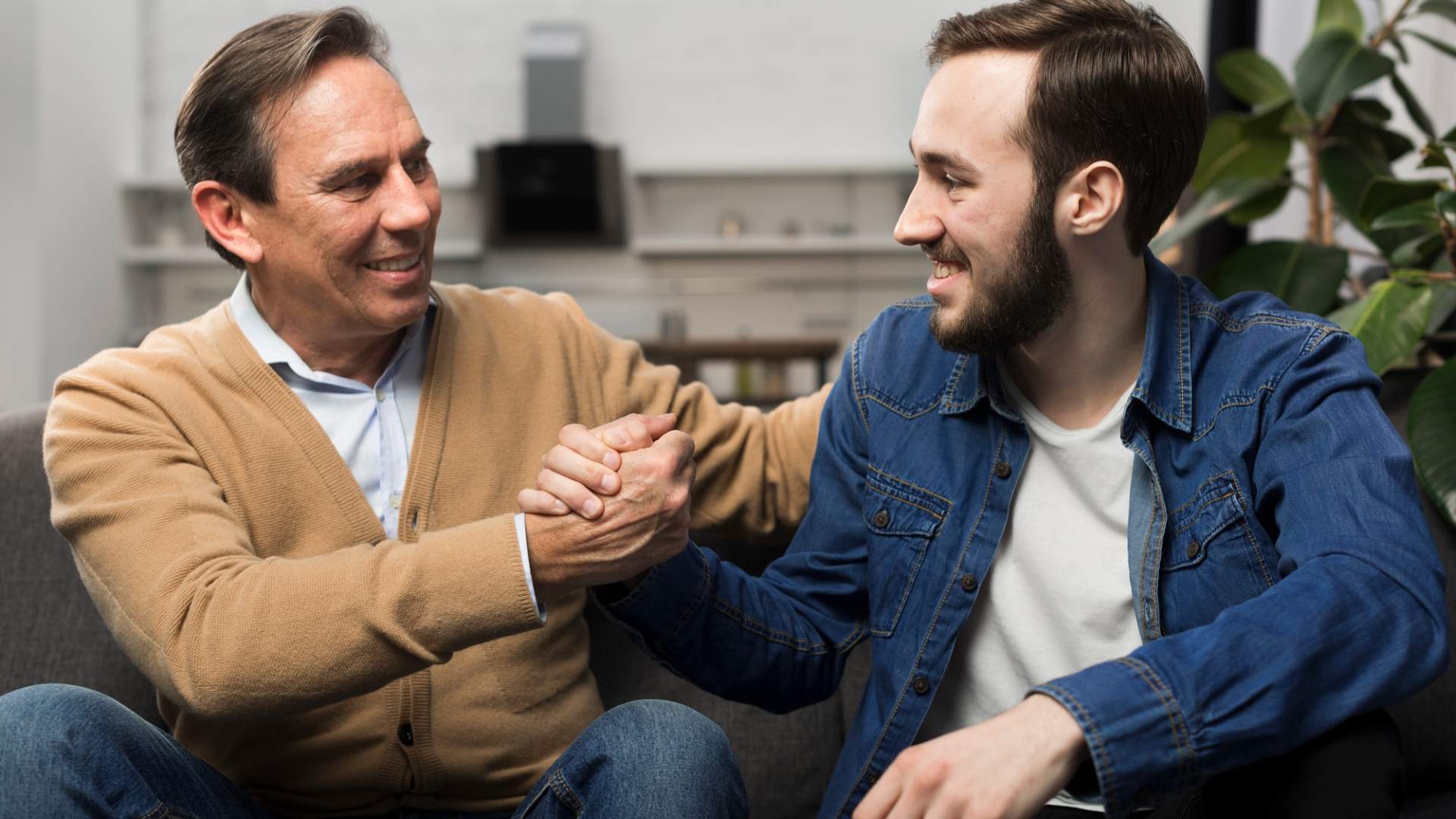 Senior father and caring son reconnecting after Ketamine to Treat Migraines in Centennial, CO therapy